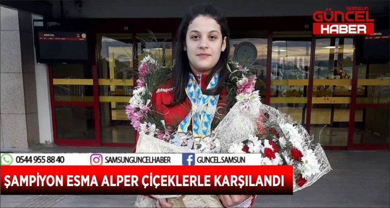 ŞAMPİYON ESMA ALPER ÇİÇEKLERLE KARŞILANDI